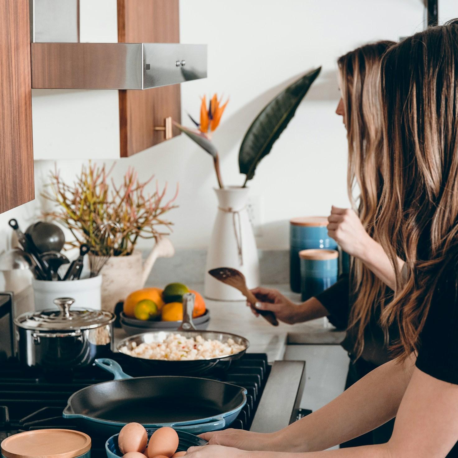 Participants working together in a modern kitchen, sharing recipes and cooking techniques